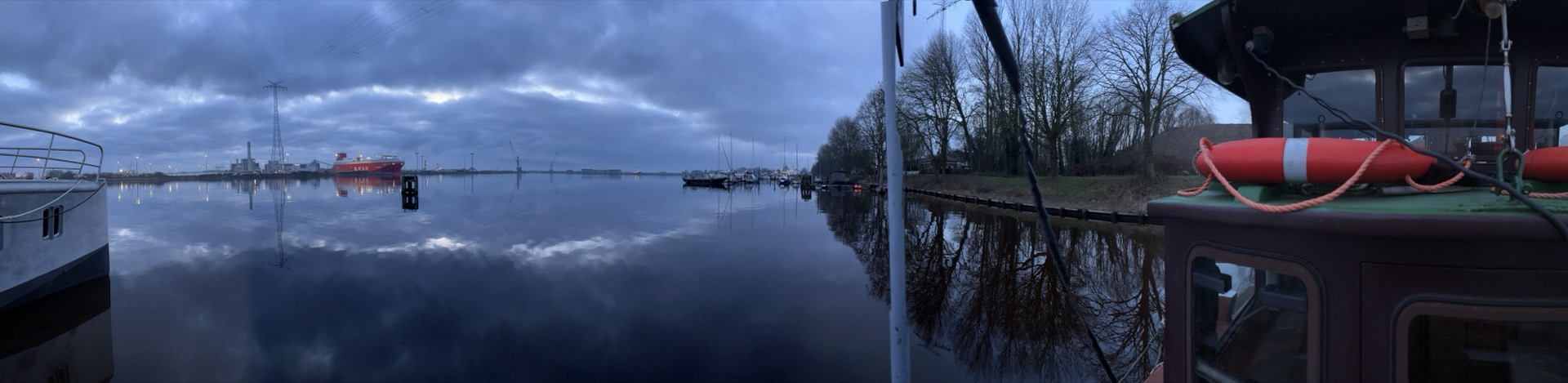 Schlomo — dawn panoramic from deck, still water and sky