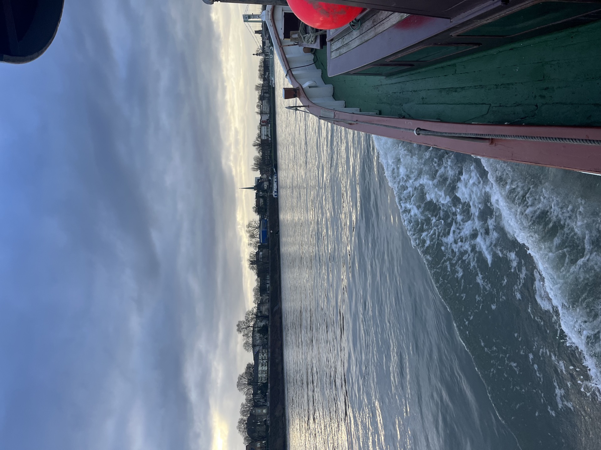 Schlomo underway — bow wave on the river